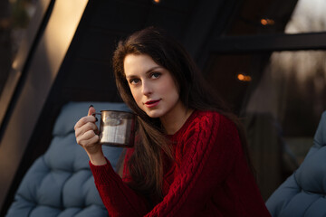 Enjoying a warm drink in a cozy setting on a chilly evening in winter