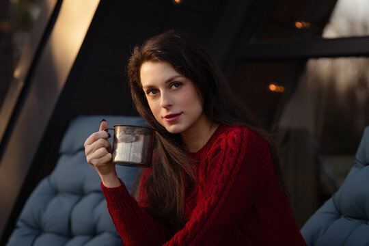 Enjoying a warm drink in a cozy setting on a chilly evening in winter