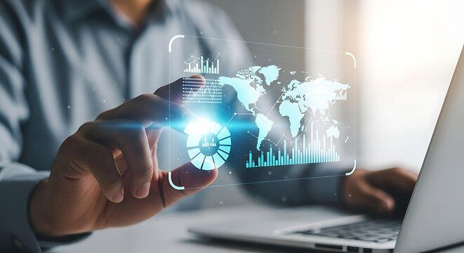 Futuristic holographic globe interface interacting with a laptop and hand