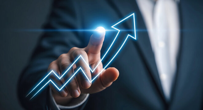 Businessman s finger points to a glowing blue upward trending graph indicating financial growth and success