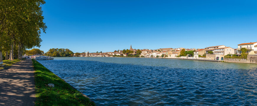View of Castelnaudary with the Canal du Midi with its boats, from the quay of the Canelot, in Castelnaudary, in Aude, in Occitanie, France
