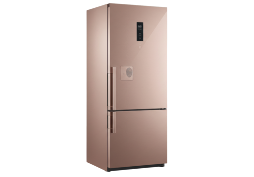 Isolated, modern style fridge freezer appliance in a rose gold color finish, indoors, no people