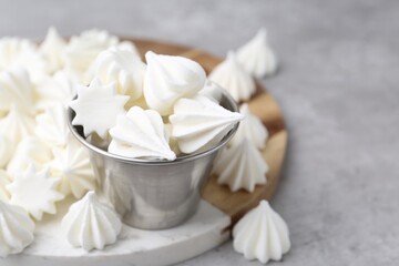 Delicious meringue cookies on grey table, closeup. Space for text