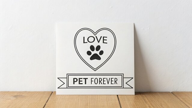 Simple artwork showing a heart with a paw print and loving words