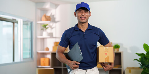 Delivery Service. Smiling courier holding package and clipboard in modern workspace.