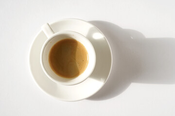 Shot of Espresso Brewed with Rich Crema on White Background.     