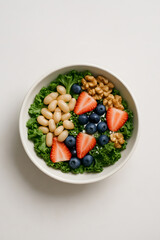 Healthy salad bowl with strawberries blueberries beans and walnuts