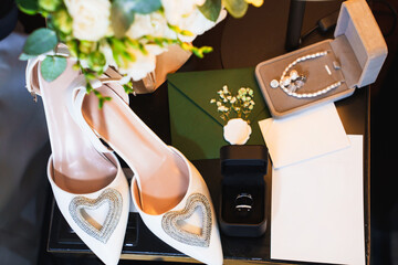 Elegant wedding preparations with accessories and bridal shoes on a table