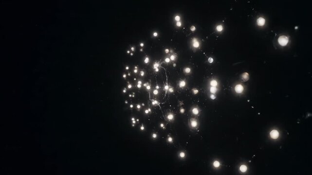 Seamlessly looping video of a dynamic network of small glowing orbs swiftly connecting and re-arranging in abstract patterns re-arranging abstract patterns, graphic element, particle connections