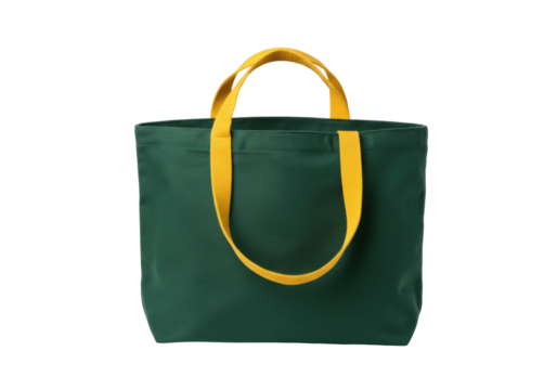 Isolated green cotton tote bag with yellow handles, blank reusable carrier for shopping
