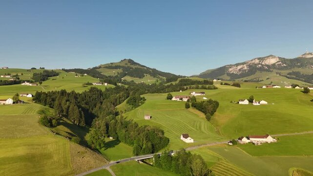 Sunset Aerial Landscape of the Swiss Alps Near Hoher Kasten with Verdant Hills, Meadows, and Towering Mountain