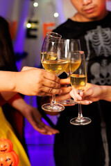 A vibrant festival atmosphere with people drinking and making a toast.