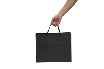 A clean, high-resolution studio shot of a hand holding kraft paper shopping bag with twisted rope handles, isolated on a pure white background. The horizontal orientation of the bag provides excellent