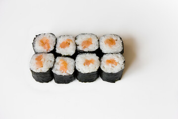 Maki sushi rolls with salmon, top view