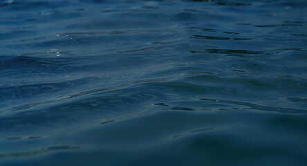 Naklejka premium Ocean water surface with waves and reflections.