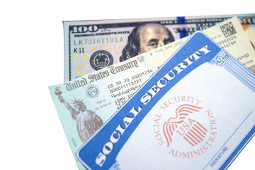 U.S. Treasry check with Social Security Card and 100 dollars bill in the backdrop, transparent. Pension, health, money