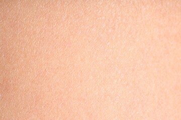 Texture of normal skin as background, closeup
