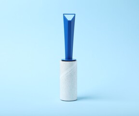 One lint roller on light blue background