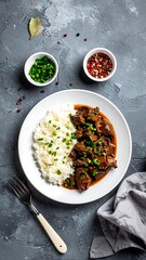Braised meat with rice on a plate