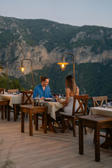 Romantic vacation moment as a couple enjoys sunset dinner