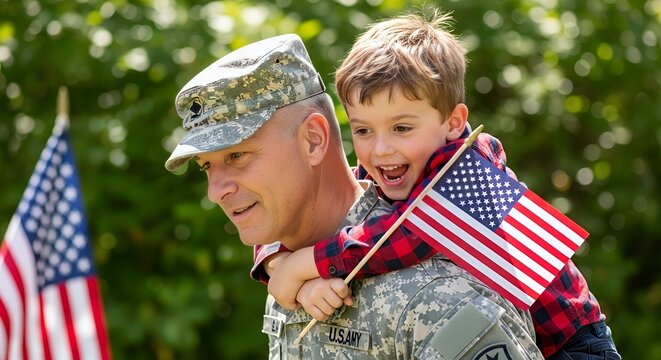A proud military father gives his smiling son a piggyback ride while waving the American flag in celebration of Veterans Day