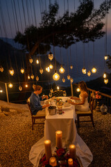Romantic vacation moment as a couple enjoys sunset dinner
