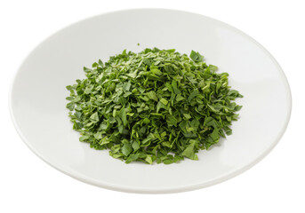 Fototapeta premium Isolated fresh chopped parsley on plate for cooking garnish and flavoring in meals dish