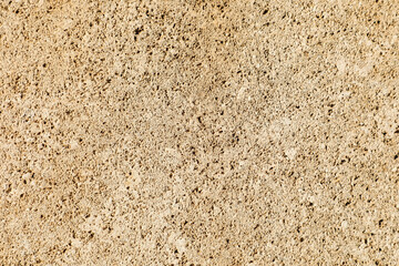 Textured beige stone wall from Malta with natural pores and rough patterns, typical of Mediterranean architecture. Warm tones and detailed surface make it perfect for backgrounds or design use.