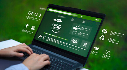 Businessman pressing button on digital technology tablet screen for environment with ESG for...