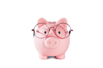 Pink piggy bank with glasses isolated on white background.
