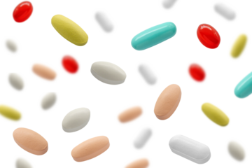 Falling medicine pills capsule isolated on white background