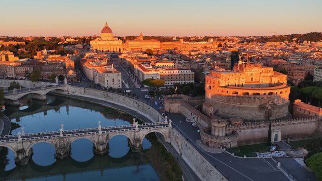 aerial view of Rome at sunrise, historic ancient Roman architecture, Sant Angelo castle and Tiber river with Sant Angelo bridge, drone shot, holidays in Rome, capital of Italy