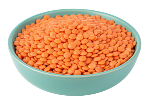 Isolated bowl of red lentils, dried pulses in a green container, healthy food concept