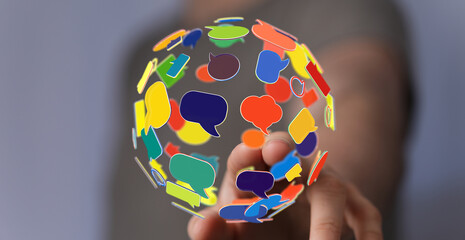 Concept of networking and social media with speech bubbles in hand. Communication, worldwide connection, digital transformation concept.