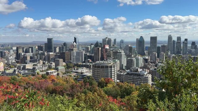 Montreal, Canada - October 08, 2025: View over the entire city of Montreal from Mont Royal, the local mountain, in glorious autumn weather and sunshine.