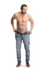 Fototapeta premium Man putting on a pair of jeans