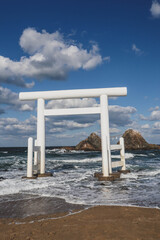 White Torii Gate and Meoto Iwa Couple Rocks in Itoshima, Japan