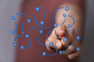 Close-up of a hand interacting with a futuristic digital network display, symbolizing connectivity, global communication, and technological inno