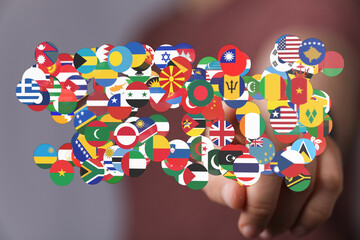 Hand interacting with global flags. This stock photo is perfect to represent international...