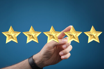 A hand reaching out to touch golden stars, perfect rating concept. Ideal for reviews, customer...