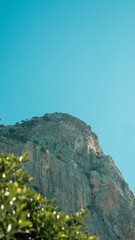 A couple enjoying morning coffee by the pool during their summer holiday.