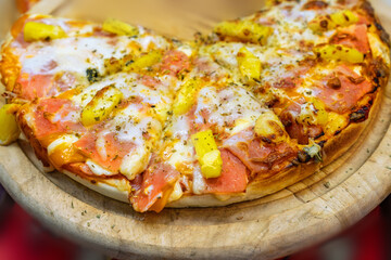 Close up pizza on a wooden tray colorful and delicious.