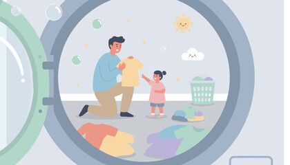 Smiling father and daughter doing laundry seen from inside a washing machine