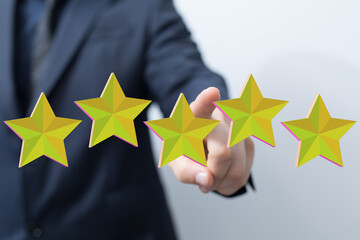 A person in a suit is touching five stars, representing a perfect rating. Illustrates customer...