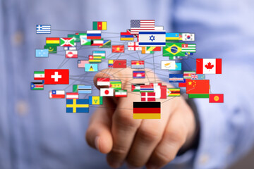 A hand touches a network of flags representing different countries, symbolizing international communication and global unity. Perfect for illust