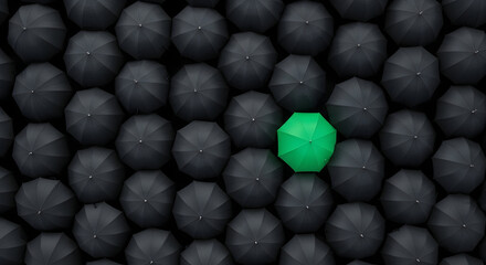 Capture attention with this image showcasing individuality, a vibrant green umbrella amidst a sea of black, symbolizing uniqueness and standing out in the crowd.