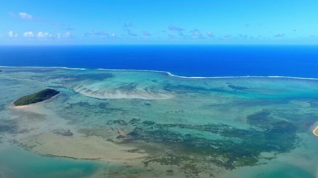 Aerial view of Mauritius island and Le Morne Brabant mountain with beautiful blue lagoon and underwater waterfall illusion background	