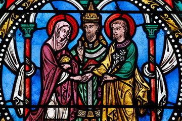 Fototapeta premium Collegiate Church of Saint Peter. Stained glass. The Marriage of the Virgin with Joseph. Le Dorat. France.