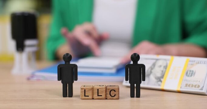 Understanding business formation with LLC blocks and paperwork on a sunny day at the office