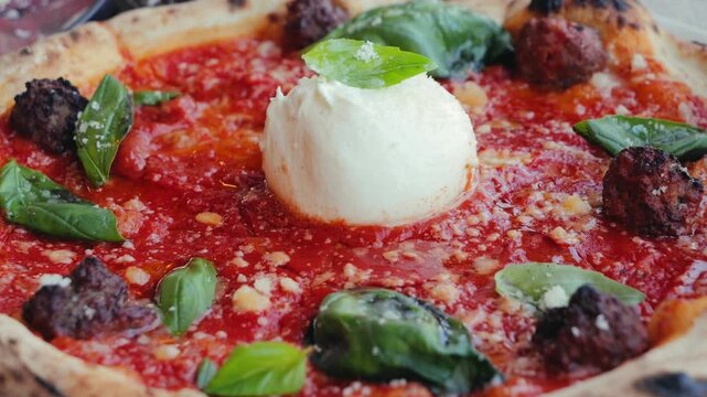 Delicious pizza with cheese mozzarella, meatballs, stracciatella burrata. Concept of italian food and cuisine. . High quality 4k footage